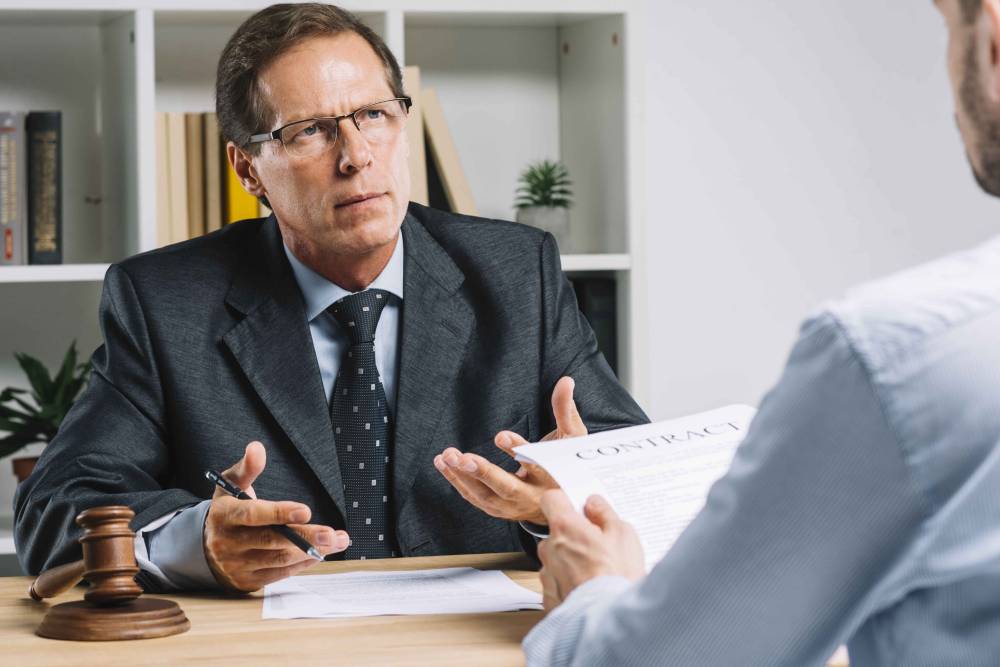 Criminal defense attorney advising a client in Fort Myers.